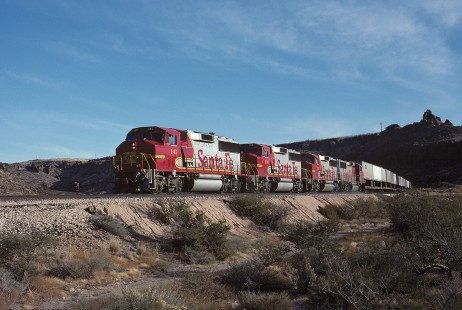 Atchison, Topeka and Santa Fe Railway diesel locomotive no. 147 leads westbound freight train near Kingman, Arizona, on December 3, 1990. Photograph by William Botkin, BOTKINW-15-WT-327 © 1990, William Botkin.