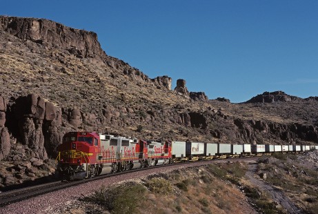 Atchison, Topeka and Santa Fe Railway diesel locomotive no. 114 leads eastbound freight train no 891 near Kingman, Arizona, on November 29, 1990. Photograph by William Botkin, BOTKINW-15-WT-281 © 1990, William Botkin.