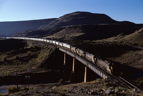 Atchison, Topeka and Santa Fe Railway diesel locomotive no. 5351 leads westbound train no. 198 at Abo Canyon, east of Sais, New Mexico, on October 12, 1985. Photograph by William Botkin, BOTKINW-15-WT-187 © 1985, William Botkin.