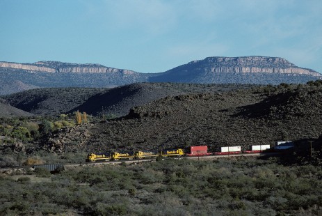 Atchison, Topeka and Santa Fe Railway diesel locomotive no. 6410 leads westbound freight train at Crozier Canyon, east of Valentine, Arizona, on November 4, 1994. Photograph by William Botkin, BOTKINW-15-WT-352 © 1994, William Botkin.