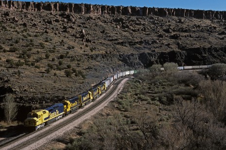 Atchison, Topeka and Santa Fe Railway diesel locomotive no. 5259 leads eastbound freight train no. 891 at Crozier Canyon, west of Truxton, Arizona, on December 12, 1986. Photograph by William Botkin, BOTKINW-15-WT-248 © 1986, William Botkin.
