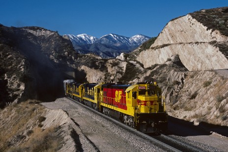 Atchison, Topeka and Santa Fe Railway diesel locomotive no. 9536 leads westbound freight train at Cajon Pass Alray-Summit, California, on December 10, 1986. Photograph by William Botkin, BOTKINW-15-WT-222 © 1986, William Botkin.
