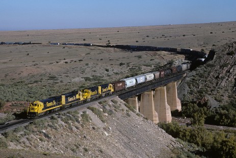 Atchison, Topeka and Santa Fe Railway diesel locomotive no. 8015 leads eastbound freight train at Abo Canyon, east of Sais, New Mexico, on October 12, 1985. Photograph by William Botkin, BOTKINW-15-WT-190 © 1985, William Botkin.