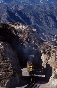 Atchison, Topeka and Santa Fe Railway diesel locomotive no. 5300 leads eastbound freight train no. 858 at Cajon Pass Alray-Summit, California, on December 10, 1986. Photograph by William Botkin, BOTKINW-15-WT-220 © 1986, William Botkin.