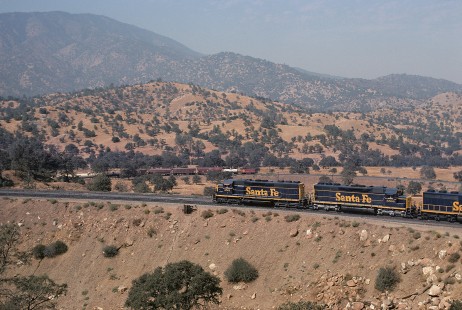 Atchison, Topeka and Santa Fe Railway diesel locomotive nos. 5501 and 5594 haul eastbound freight at Walong, California, on September 26, 1974. Photograph by William Botkin, BOTKINW-15-WT-75 © 1974, William Botkin.