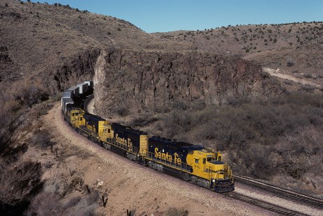 Atchison, Topeka and Santa Fe Railway diesel locomotive no. 4002 leads westbound freight train at Crozier Canyon, west of Truxton, Arizona, on December 1, 1990. Photograph by William Botkin, BOTKINW-15-WT-306 © 1990, William Botkin.