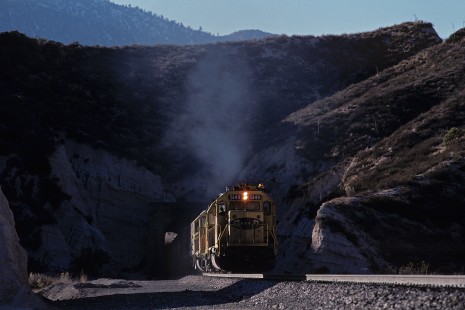 Atchison, Topeka and Santa Fe Railway diesel locomotive no. 5149 leads eastbound freight train at Cajon Pass Alray-Summit, California, on December 11, 1986. Photograph by William Botkin, BOTKINW-15-WT-236 © 1986, William Botkin.