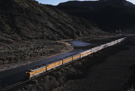 Denver and Rio Grande Western Railroad diesel locomotive no. 5771 leads eastbound Rio Grande Zephyr no. 18 west of Bond, Colorado, on April 17, 1983. Photograph by William Botkin, BOTKINW-8-WT-869 © 1983, William Botkin.