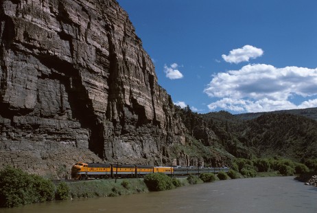Denver and Rio Grande Western Railroad locomotive no. 5771 leads Rio Grande Zephyr no. 18 at Glenwood Canyon between Shoshone and Allen, Colorado, on June 15, 1975. Photograph by William Botkin, BOTKINW-8-WT-316 © 1975, William Botkin.