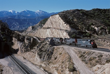 Southern Pacific Railroad locomotive no. 7533 hauls westbound freight at Cajon Pass Canyon in Hiland, California, on December 10, 1986. Photograph by William Botkin, BOTKINW-18-WT-92 © 1986, William Botkin.
