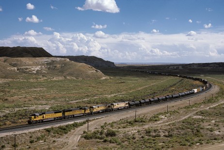 Union Pacific Railroad locomotive no. 6037 hauls westbound freight at milepost 775 at Point of Rocks, Wyoming, at 3:10 pm on September 8, 1986. Photograph by William Botkin, BOTKINW-19-WT-443 © 1986, William Botkin.