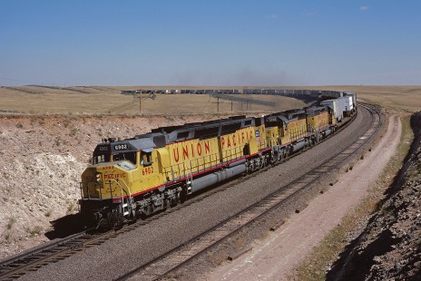 Union Pacific Railroad locomotive no. 6902 hauls westbound piggyback freight train VAN 1 at Lynch, Wyoming, at 12:45 pm on September 22, 1984. Photograph by William Botkin, BOTKINW-19-WT-332 © 1984, William Botkin.
