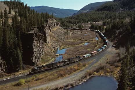 Denver and Rio Grande Western Railroad diesel locomotive no. 5353 hauls westbound freight at Pando, Colorado, on October 6, 1991. Photograph by William Botkin, BOTKINW-8-WT-1189 © 1991, William Botkin.