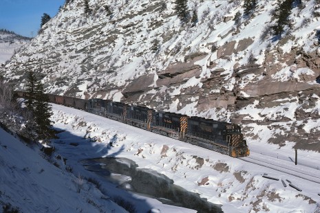 Denver and Rio Grande Western Railroad locomotive nos. 3078, 3033, and 3020 lead eastbound coal west of Minturn, Colorado, in December, 1978. Photograph by William Botkin, BOTKINW-8-WT-543 © 1978, William Botkin.