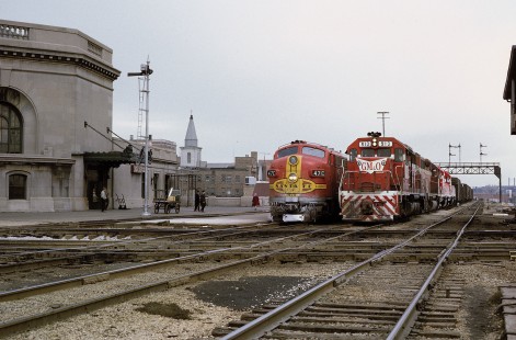Atchison, Topeka and Santa Fe Railway locomotive no. 47C leads a westbound passenger train next to Gulf, Mobile and Ohio Railroad locomotive no. 913 as it leads southbound freight at Joliet, Illinois, on March 30, 1971. Photograph by William Botkin, BOTKINW-25-WT-14 © 1971, William Botkin.