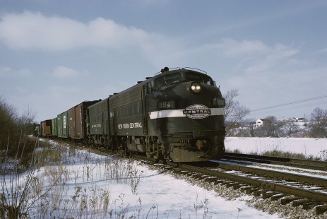Penn Central locomotive no. 1841 hauls westbound freight at Ann Arbor, Michigan, in March, 1970. This photograph was taken around 2 years after the New York Central and Penn Central merger, and these F-units are still in the New York Central Railroad livery. Photograph by William Botkin, BOTKINW-10-WT-233 © 1970, William Botkin.