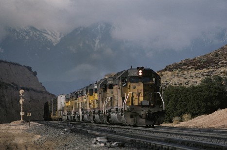 Union Pacific Railroad locomotive no. 3715 hauls eastbound freight at Cajon Pass in Summit, California, in January, 1986. Photograph by William Botkin, BOTKINW-19-WT-416 © 1986, William Botkin.