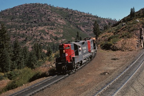 Southern Pacific Railroad locomotive no. 3369 hauls westbound freight at Cisco, California, on September 21, 1974. Photograph by William Botkin, BOTKINW-18-WT-27 © 1974, William Botkin.