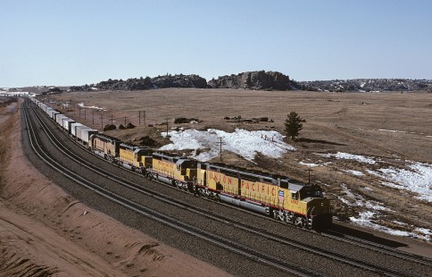 Union Pacific Railroad locomotive no. 6902 hauls eastbound piggyback freight train OAWST at Dale Junction, Wyoming, at 3:05 pm on March 14, 1985. Photograph by William Botkin, BOTKINW-19-WT-388 © 1985, William Botkin.
