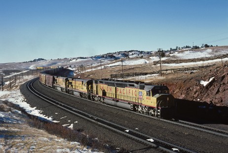 Union Pacific Railroad locomotive no. 6902 leads eastbound freight, including refrigerator cars and trailers, at Sherman, Wyoming, at 2:05 pm on December 6, 1984. Photograph by William Botkin, BOTKINW-19-WT-349 © 1984, William Botkin.