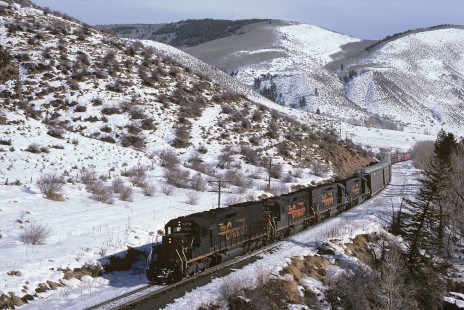 Denver and Rio Grande Western Railroad diesel locomotive no. 5374 hauls westbound freight train no. 179 east of Avon, Colorado, on December 23, 1985. Photograph by William Botkin, BOTKINW-8-WT-1033A © 1985, William Botkin.