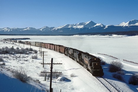 Denver and Rio Grande Western Railroad diesel locomotive nos. 5344 and 3070 haul westbound freight train no. 79 west of Malta, Colorado, on January 4, 1985. Photograph by William Botkin, BOTKINW-8-WT-962 © 1985, William Botkin.