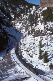 Denver and Rio Grande Western Railroad diesel locomotive no. 3121 pulls eastbound freight train no. 150 at Belden, Colorado, on December 23, 1985. Photograph by William Botkin, BOTKINW-8-WT-1032 © 1985, William Botkin.