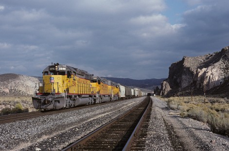 Union Pacific Railroad locomotive no. 3598 hauls eastbound freight at Eccles, Nevada, at 2:40 pm, on October 29, 1992. Photograph by William Botkin, BOTKINW-19-WT-523 © 1992, William Botkin.