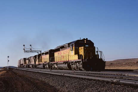 Union Pacific Railroad locomotive no. 3464 hauls eastbound freight at Hermosa, Wyoming, at 5:00 pm on March 14, 1985. Photograph by William Botkin, BOTKINW-19-WT-391 © 1985, William Botkin.