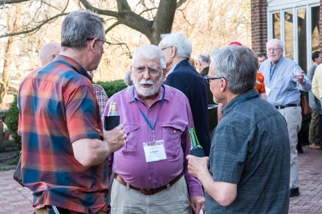 Photographer George Hiotis chats with fellow attendees at the Friday reception. (EL)