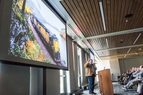 Presenter Steve Smedley entertained the crowd with "Rails: A Photojournalist's Journey," images from his rail photography and journalism career. (EL)