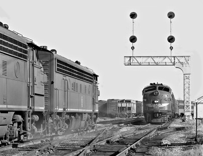 Northbound Missouri Pacific Railroad <i>Texas Eagle</i> passenger train passes freight near the station in Austin, Texas, in August 1962. Photograph by J. Parker Lamb, © 2016, Center for Railroad Photography and Art. Lamb-02-058-09
