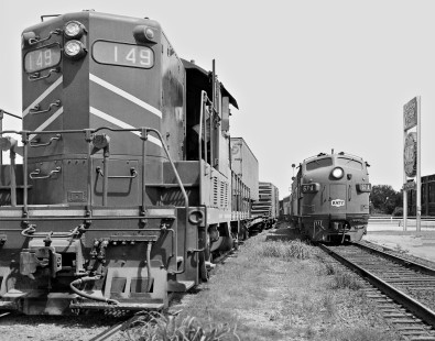 Northbound Missouri–Kansas–Texas Railroad freight train passes Missouri Pacific Railroad switcher at station in Austin, Texas, in July 1965. MKT used MP line between San Marcos and Taylor. Photograph by J. Parker Lamb, © 2016, Center for Railroad Photography and Art. Lamb-02-041-01