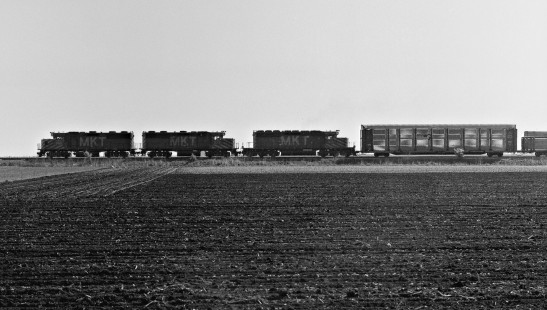 Northbound Missouri–Kansas–Texas Railroad freight train approaching La Grange, Texas, allows one to compare sizes of GP and SD locomotives as well as auto carriers in March 1970. Photograph by J. Parker Lamb, © 2016, Center for Railroad Photography and Art. Lamb-02-076-09