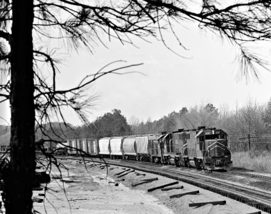Eastbound Missouri Pacific Railroad freight train passes partially completed double-track section east of Marshall, Texas, in March 1965. Photograph by J. Parker Lamb, © 2016, Center for Railroad Photography and Art. Lamb-02-080-09