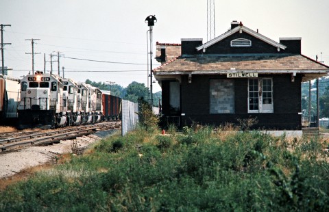 Northbound Kansas City Southern Railway freight train at station in Stilwell, Oklahoma, on July 18, 1977. Photograph by John F. Bjorklund, © 2016, Center for Railroad Photography and Art. Bjorklund-61-14-15