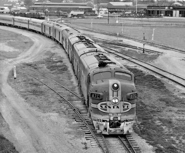 Northbound Atchison, Topeka and Santa Fe Railway <i>Texas Chief</i> passenger train departs Temple, Texas, in October 1954. Locomotive service area in background, as is ATSF line to Clovis, New Mexico. Photograph by J. Parker Lamb, © 2016, Center for Railroad Photography and Art. Lamb-02-066-05