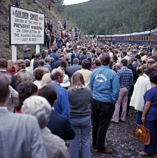 Crowd gathers at the 50th anniversary golden spike ceremony for the Alaska Railroad near Nenana, Alaska, on July 15, 1973. Photograph by Leo King, © 2015, Center for Railroad Photography and Art. King-02-041-005