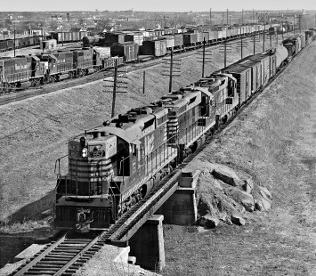Northbound Chicago, Burlington and Quincy Railroad freight train passes Rock Island's Peach Yard as it departs Fort Worth, Texas, behind SD7 locomotives in March 1969. Photograph by J. Parker Lamb, © 2016, Center for Railroad Photography and Art. Lamb-02-075-04