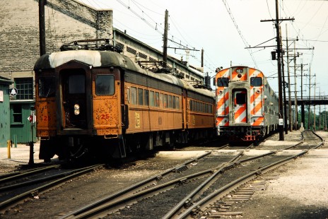 Westbound South Shore Line passenger cars in Michigan City, Indiana, on May 16, 1982. Photograph by John F. Bjorklund, © 2015, Center for Railroad Photography and Art. Bjorklund-42-16-20