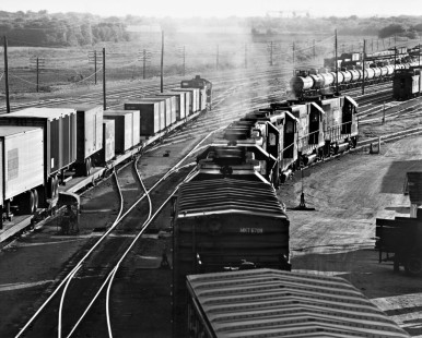 New Missouri Pacific GP35 locomotives head west from Fort Worth, Texas, with El Paso-bound tonnage in August 1969. Photograph by J. Parker Lamb, © 2016, Center for Railroad Photography and Art. Lamb-02-063-10