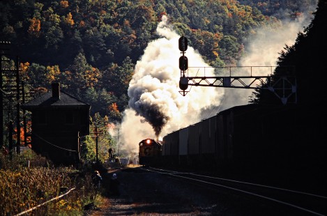 Diesel helpers assist Chesapeake and Ohio Railway steam locomotive no. 614 with the eastbound "Chessie Safety Express" at Alleghany, Virginia, on October 13, 1980, while a freight train passes on the adjacent track. Photograph by John F. Bjorklund, © 2015, Center for Railroad Photography and Art. Bjorklund-34-25-07