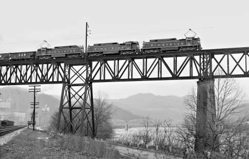 Three ex-Viriginan Railway electric locomotives lead an eastbound Norfolk & Western coal train over the New River at Glen Lynn, Virginia, in December 1961, just before the end of electric operations. Photograph by J. Parker Lamb, © 2016, Center for Railroad Photography and Art. Lamb-01-091-03