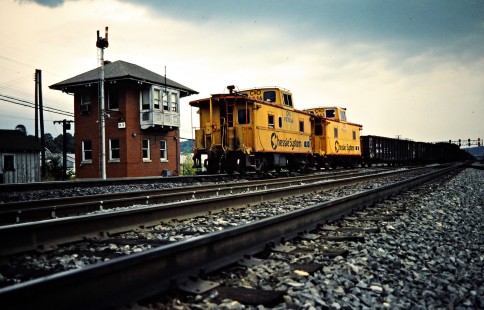 Two cabooses on an eastbound Chesapeake and Ohio Railway freight train in Kenova, West Virginia, on September 25, 1982. Photograph by John F. Bjorklund, © 2015, Center for Railroad Photography and Art. Bjorklund-35-11-02