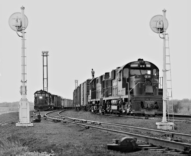 Eastbound Southern Pacific Railroad freight train departs East Yard in San Antonio, Texas, as switcher prepares to shove cut in April 1965. Photograph by J. Parker Lamb, © 2016, Center for Railroad Photography and Art. Lamb-02-052-03