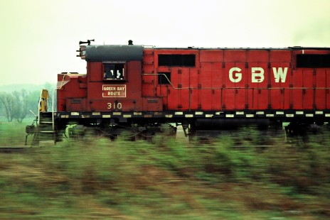 Eastbound Green Bay and Western Railroad Alco C424 locomotive no. 310 speeds pass Arcadia, Wisconsin, on May 13, 1982. Photograph by John F. Bjorklund, © 2015, Center for Railroad Photography and Art. Bjorklund-43-08-05