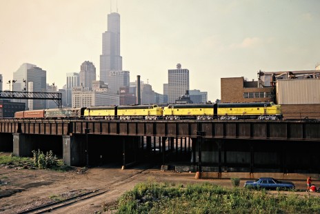 Chicago and North Western Railway passenger train in Chicago, Illinois, on August 6, 1983. Photograph by John F. Bjorklund, © 2015, Center for Railroad Photography and Art.  Bjorklund-27-28-07