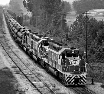 Gulf, Mobile and Ohio Railroad freight train Extra 919 South departs yard in Meridian, Mississippi, with long cut of pipe for docks in Mobile, Alabama, in September 1968. Photograph by J. Parker Lamb, © 2016, Center for Railroad Photography and Art. Lamb-01-127-08