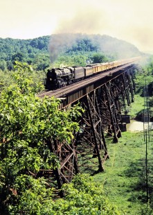 Northbound Chesapeake and Ohio Railway passenger excursion train led by stream locomotive no. 614 crossing bridge in Sciotoville, Ohio, on May 17, 1981. Photograph by John F. Bjorklund, © 2015, Center for Railroad Photography and Art. Bjorklund-35-01-14