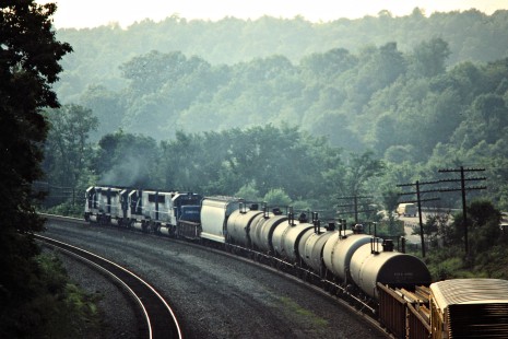 Westbound Conrail freight train in Homewood, Pennsylvania, on June 22, 1986. Photograph by John F. Bjorklund, © 2015, Center for Railroad Photography and Art. Bjorklund-30-05-01